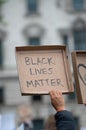 Protesters holding sign at Black Lives Matter protest demonstration in London. Royalty Free Stock Photo