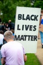 Protester holding sign at the UK Black Lives Matter protest at Hyde Park in London. Royalty Free Stock Photo