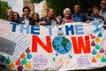 Climate change campaigners with large banner at the Time Is Now demonstration in central London.