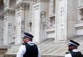 Police walk past graffiti covered buildings at the Black Lives Matter protest demonstration in London. Royalty Free Stock Photo