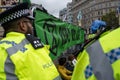 Metropolitan police officers monitoring Extinction Rebellion protesters at Trafalgar Square London UK. signtalkin