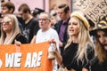 Young girl in yellow beret with banners and placards shouting at Save Our Children Protest against Children Trafficking Royalty Free Stock Photo