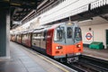 London Underground train arriving at an outdoor platform of Golders Green tube station, London, UK Royalty Free Stock Photo