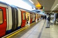 A London Underground train sits at the platform at Paddington Station. Royalty Free Stock Photo