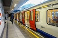 A London Underground train sits at the platform at Paddington Station. Royalty Free Stock Photo