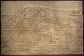 London, United Kingdom - Ancient Assyria clay tablet relief of Assyrian army soldiers invading Egypt from king Ashurbanipal royal