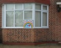 London, United Kingdom - April 08, 2020: Hand drawn rainbow and poster with thank you note to NHS displayed at house in Lewisham,