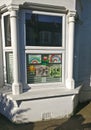 London, United Kingdom - April 15, 2020: Hand drawn rainbow and poster with thank you note to NHS and essential workers displayed