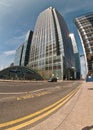 London, United Kingdom - April 06, 2007: Sun shines on empty road near Canary Wharf tube station entrance, tall glass and steel. Royalty Free Stock Photo