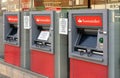 London, United Kingdom - April 09, 2020: Three Santander bank ATM withdrawal terminals with middle one disabled to support social