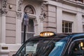 Close up of an illuminated taxi sign on a black cab in London, UK Royalty Free Stock Photo