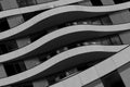 Facade of modern building showing curved balconies in black and white Royalty Free Stock Photo