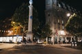 People relaxing by Sundial Pillar and walking around Seven Dials, Covent Garden, London, UK Royalty Free Stock Photo