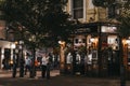 People walking past The Crown pub and shops in Seven Dials, Covent Garden, London, UK Royalty Free Stock Photo