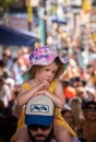 Little girl attending the family day at the Notting Hill Carnival together with ther