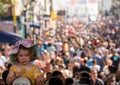 Little girl attending the family day at the Notting Hill Carnival together with ther