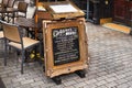 London, United Kingdom - February 02, 2019: Black Chalkboard with old ornate frame, and Children menu standing on pavement next to