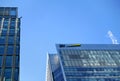 London, United Kingdom - February 03, 2019: Blue and yellow EY signage at entrance to their office in Canary Wharf. It is UK Royalty Free Stock Photo