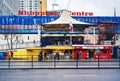 London, United Kingdom - February 04, 2019: Elephant and Castle shopping centre, with small shops in front. People walking on