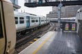 London, United Kingdom - February 01, 2019: Empty platform of London Bridge station on overcast day, Thameslink train arriving. Royalty Free Stock Photo