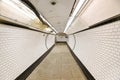 London, United Kingdom - February 24, 2007: Extreme wide angle fisheye photo of tunnel at London tube station leading to train Royalty Free Stock Photo