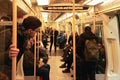 London, United Kingdom - February 01, 2019: Interior of District Line underground train with many passengers in winter clothes Royalty Free Stock Photo