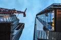 London, United Kingdom - February 02, 2019: Looking up glass and steel Shard skyscraper, construction crane near, evening sky