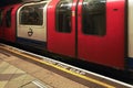 London, United Kingdom - February 01, 2019: MIND THE GAP text on floor of London underground station, waiting train behind white