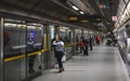 London, United Kingdom - February 02, 2019: Passengers waiting at Waterloo underground station behind closed glass door for tube Royalty Free Stock Photo