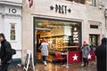 London, United Kingdom - February 01, 2019: Pedestrians walking in front Pret a Manger sandwich shop at one of their branch in. Royalty Free Stock Photo