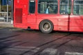 London, United Kingdom - February 03, 2019: Rear detail of iconic red bus used in UK capital, with passengers commuting in the