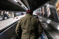 London, United Kingdom - February 02, 2019: Riding up the escalators in London tube during busy time, people on both sides