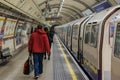 London, United Kingdom, February 17, 2018: London Underground station with people leaving train and moving out of Royalty Free Stock Photo