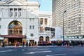 London, United Kingdom - February 02, 2019: Victoria Palace theatre entrance on sunny day, main road in front. People wait in