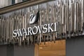 London, United Kingdom - February 01, 2019: White swan and text logo on Swarovski shop at their Oxford Street branch. It is.