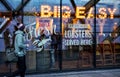 London, United Kingdom - February 03, 2019: Yellow neon letters sign on Big Easy restaurant window at their Canary Wharf branch.