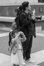 LONDON, UNITED KINGDOM - Jul 09, 2109: A young girl taking a photograph