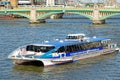 A City Cruises tour boat sails on the Thames River Royalty Free Stock Photo