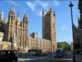 A view from Abingdon Street of the Victoria Tower of Westminster Palace on a sunny summer day in Central London, UK. Royalty Free Stock Photo