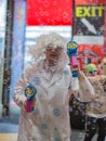 London, United Kingdom- June 2019: Boy with Wig with White Curls who Shoots Soap Bubbles with Toy Gun Royalty Free Stock Photo