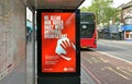 London, United Kingdom - June 06, 2020: Light ad at Lewisham bus stop informing passengers all buses are cleaned and disinfected Royalty Free Stock Photo