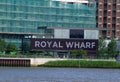 Riverside sign for Royal Wharf housing redevelopment adjacent to River Thames Royalty Free Stock Photo