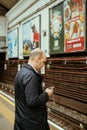 Male man using iPhone smartphone telephone in London tube underground Royalty Free Stock Photo