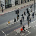High perspective view of officer worker pedestrians in the City of London crossing the street