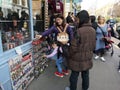 LONDON, UNITED KINGDOM - MARCH 30, 2019 : Unidentified asian tourists choosing souvenir at Portobello Market in Notting Hill on