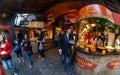 London, United Kingdom - March 31, 2007: Unknown shoppers eating street food while walking at Camden Lock, famous market Royalty Free Stock Photo