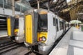 London, United Kingdom - May 14, 2019: Stansted Express Train on the platform at Victoria railway Station, Modern