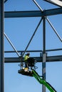 LONDON, UNITED KINGDOM - MAY 04 2016 - Steel frame of new building in construction with construction worker on crane lift