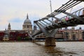 The Millenium Bridge and Saint Paul Cathedral on a typical cloudy day in London Royalty Free Stock Photo