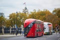 LONDON, UNITED KINGDOM - NOVEMBER 13, 2021: Famous double decker red buses on a street of London